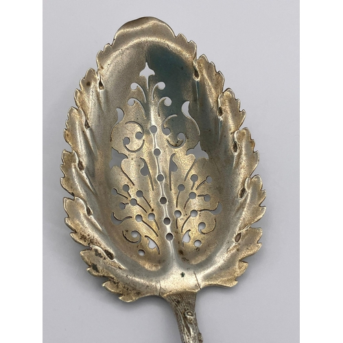 518 - Rare Antique SILVER SIFTING SPOON in the shape of a branch.Having a leaf design bowl with a twig sha... 