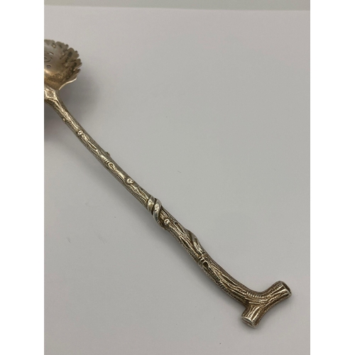 518 - Rare Antique SILVER SIFTING SPOON in the shape of a branch.Having a leaf design bowl with a twig sha... 