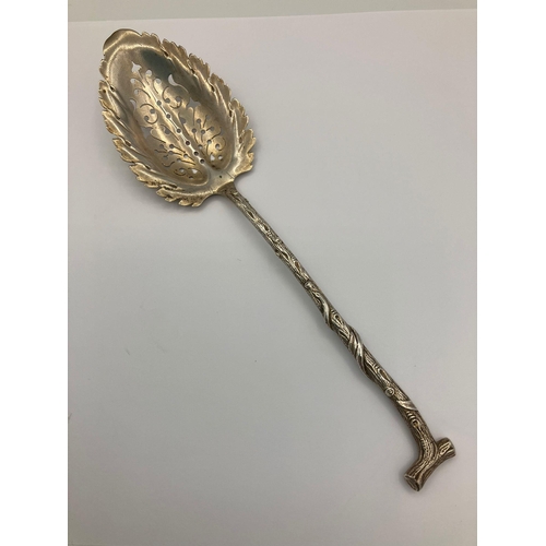 518 - Rare Antique SILVER SIFTING SPOON in the shape of a branch.Having a leaf design bowl with a twig sha... 