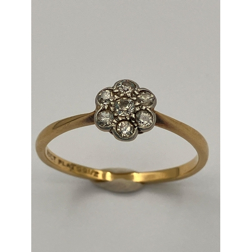 62 - Vintage 18 carat GOLD RING with PLATINUM set DIAMONDS mounted in floral formation. 1.9 grams. Size P... 