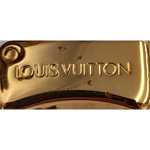 177 - A Louis Vuitton Speedy Bag. Monogramed canvas exterior with gold-toned hardware, two rolled leather ... 