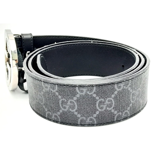 191 - A Gucci Black with Grey Monogram Men's GG Belt. Silver-toned hardware. Approximately 104.5cm length,... 