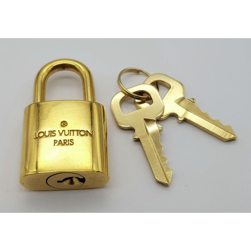 269 - A Louis Vuitton Gold Plated Lock with Two Keys.