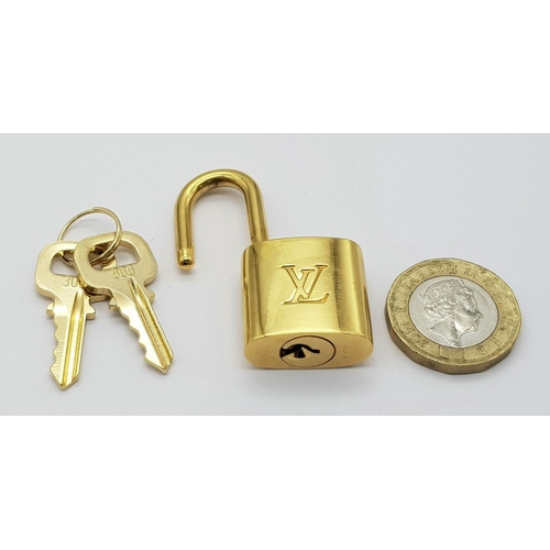 269 - A Louis Vuitton Gold Plated Lock with Two Keys.