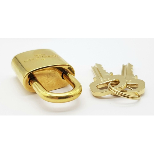 269 - A Louis Vuitton Gold Plated Lock with Two Keys.