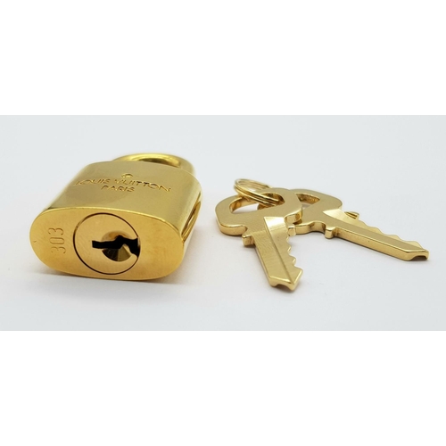 269 - A Louis Vuitton Gold Plated Lock with Two Keys.