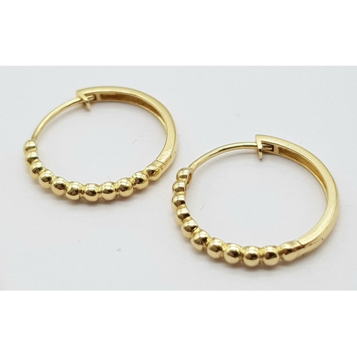 31 - A Pair of 14k Gold Designer Massika Earrings. 1.8g total weight.