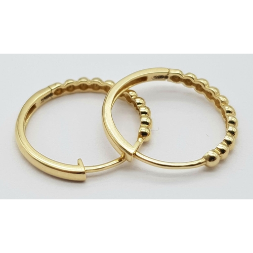 31 - A Pair of 14k Gold Designer Massika Earrings. 1.8g total weight.