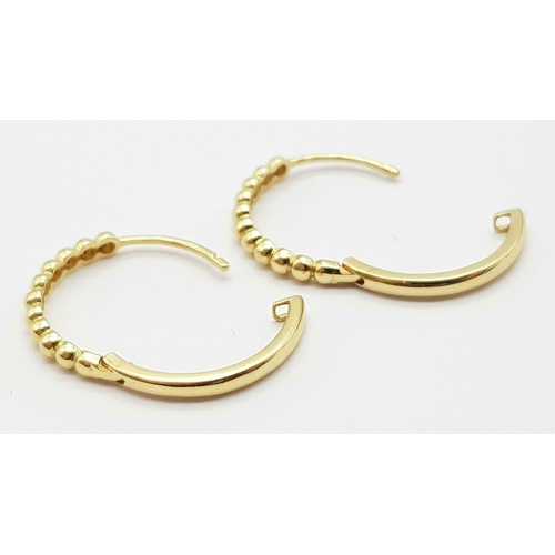 31 - A Pair of 14k Gold Designer Massika Earrings. 1.8g total weight.