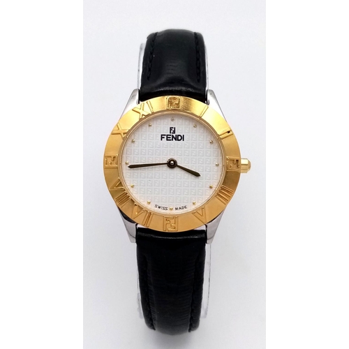 339 - A Fendi Designer Quartz Ladies Watch. Black leather strap. Gilded circular case - 26mm. In working o... 