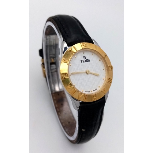 339 - A Fendi Designer Quartz Ladies Watch. Black leather strap. Gilded circular case - 26mm. In working o... 