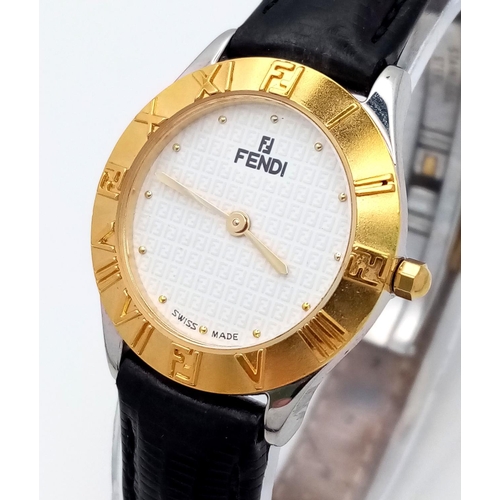 339 - A Fendi Designer Quartz Ladies Watch. Black leather strap. Gilded circular case - 26mm. In working o... 