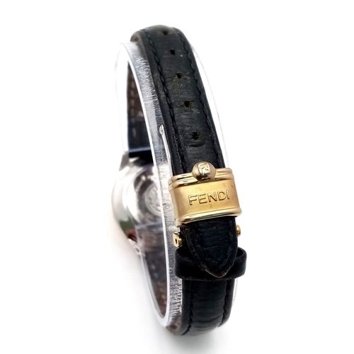 339 - A Fendi Designer Quartz Ladies Watch. Black leather strap. Gilded circular case - 26mm. In working o... 