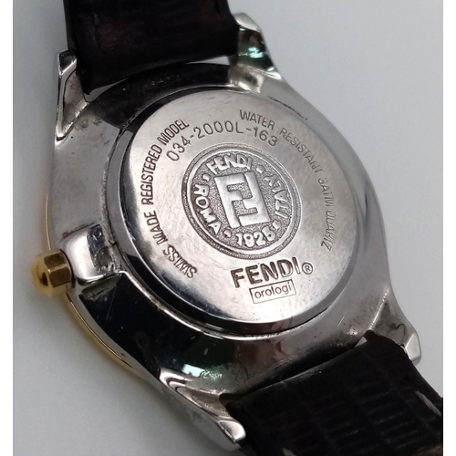 339 - A Fendi Designer Quartz Ladies Watch. Black leather strap. Gilded circular case - 26mm. In working o... 