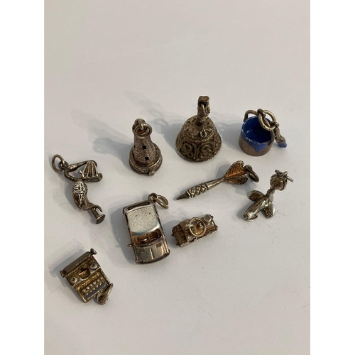 196 - Selection of vintage SILVER CHARMS. To include Lighthouse, Metro car, Train engine, Stork,Sea  lion,... 