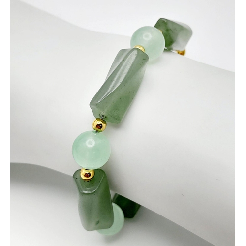 1691 - A high-quality light green, semi-translucent, jade necklace, bracelet and earrings set. Necklace len... 