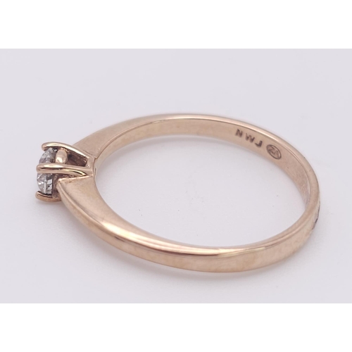 583 - A 9K Rose Gold Diamond Solitaire Ring. 0.10ct round cut diamond. Size N. 2g total weight.