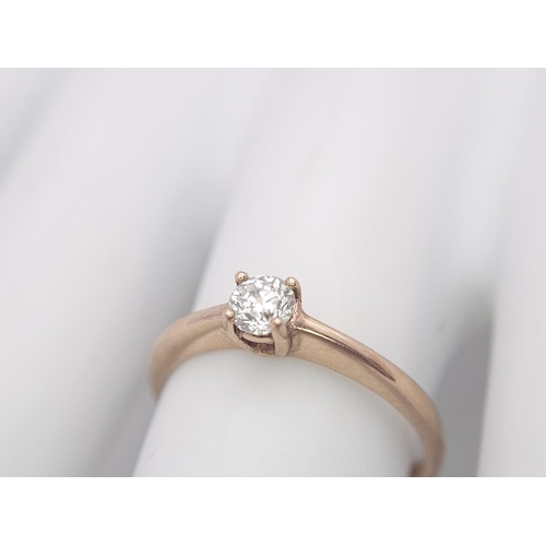 583 - A 9K Rose Gold Diamond Solitaire Ring. 0.10ct round cut diamond. Size N. 2g total weight.