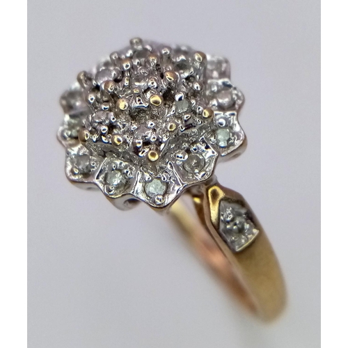 179 - A 9K YELOW GOLD DIAMOND RING IN THE FLORAL DESIGN 0.20CT 3.6G SIZE O.

SC 9003