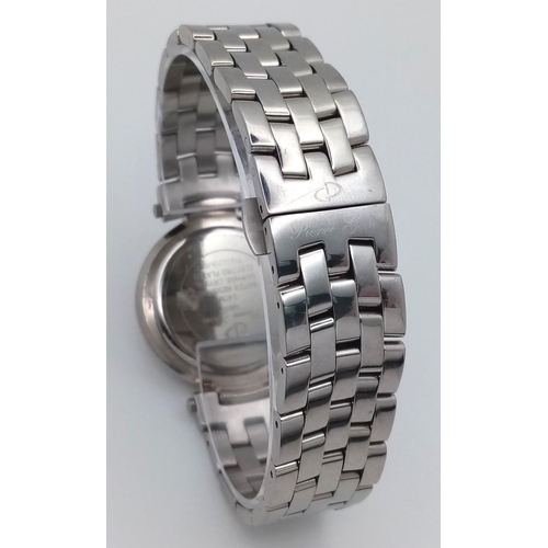 124 - A Pierre Gene Quartz Gents Watch. Stainless steel bracelet and case - 34mm. White dial with date win... 