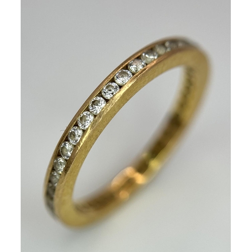 4 - A 22K YELLOW GOLD STONE SET FULL ETERNITY RING. 0.50CT. 2.7G SIZE N