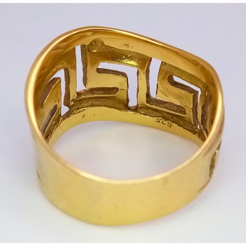 63 - A Decorative Pierced 18K Yellow Gold Ring. Size P. 7.1g weight.