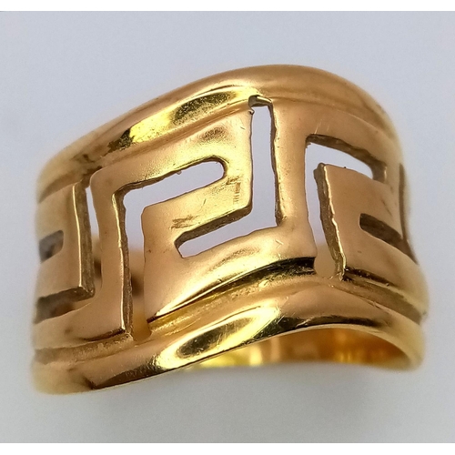 63 - A Decorative Pierced 18K Yellow Gold Ring. Size P. 7.1g weight.