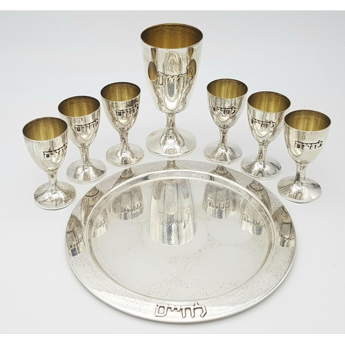 84 - An Israeli 925 Silver Kiddush Cup Set with Serving Plate. One large cup and six smaller cups. 425g t... 