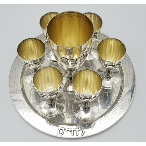 84 - An Israeli 925 Silver Kiddush Cup Set with Serving Plate. One large cup and six smaller cups. 425g t... 