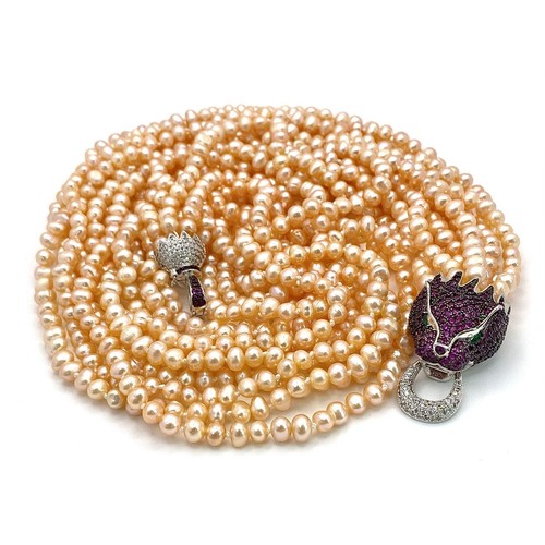 133 - A very glamorous, eleven strand (yes eleven!!!) genuine natural pink pearl necklace with a large, st... 