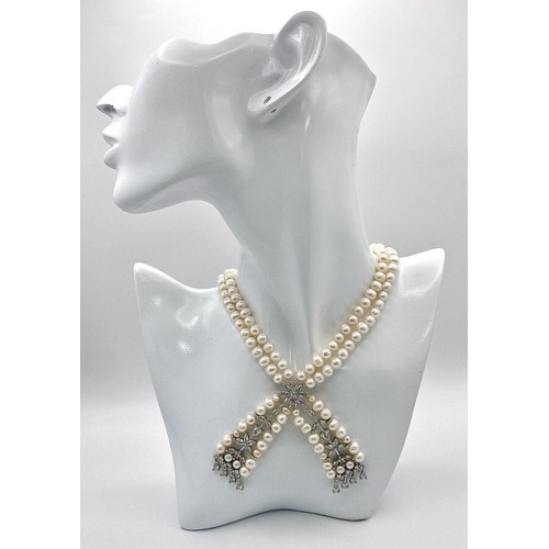 196 - A fabulously designed pearl necklace with cubic zirconia. The genuine natural white pearls are of ex... 