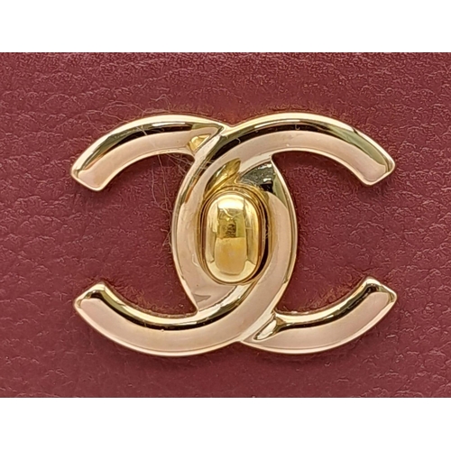 99 - A Chanel Neo Executive Leather Tote Bag. Burgundy leather exterior with gold tone hardware and two l... 