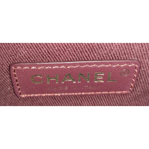 99 - A Chanel Neo Executive Leather Tote Bag. Burgundy leather exterior with gold tone hardware and two l... 