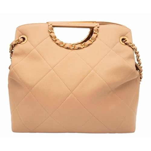 122 - A Chanel Two-Way Chain Shoulder Bag. Beige caviar leather.
Gold tone hardware. Spacious interior wit... 