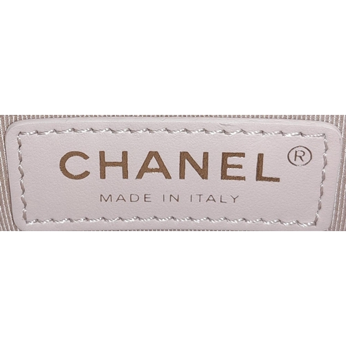 122 - A Chanel Two-Way Chain Shoulder Bag. Beige caviar leather.
Gold tone hardware. Spacious interior wit... 