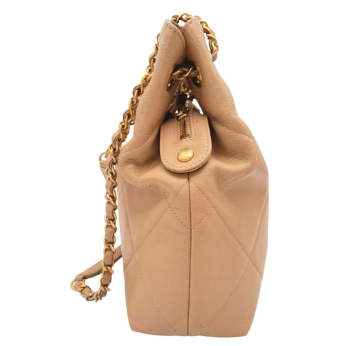122 - A Chanel Two-Way Chain Shoulder Bag. Beige caviar leather.
Gold tone hardware. Spacious interior wit... 