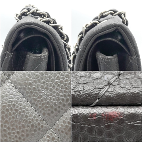 129 - A Chanel Jumbo Double Flap Maxi Bag. Dark grey quilted caviar leather exterior with a large slip poc... 