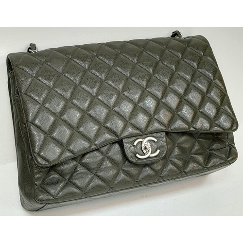 141 - A Chanel Green Jumbo Classic Double Flap Bag. Quilted leather exterior with silver-toned hardware, c... 