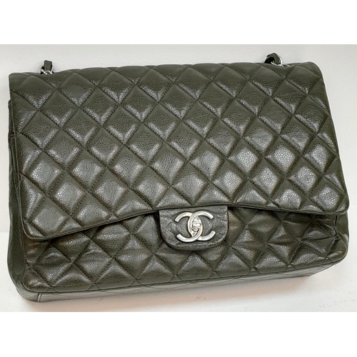141 - A Chanel Green Jumbo Classic Double Flap Bag. Quilted leather exterior with silver-toned hardware, c... 