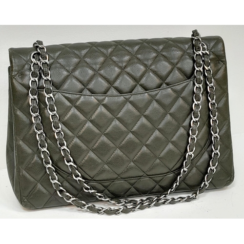 141 - A Chanel Green Jumbo Classic Double Flap Bag. Quilted leather exterior with silver-toned hardware, c... 