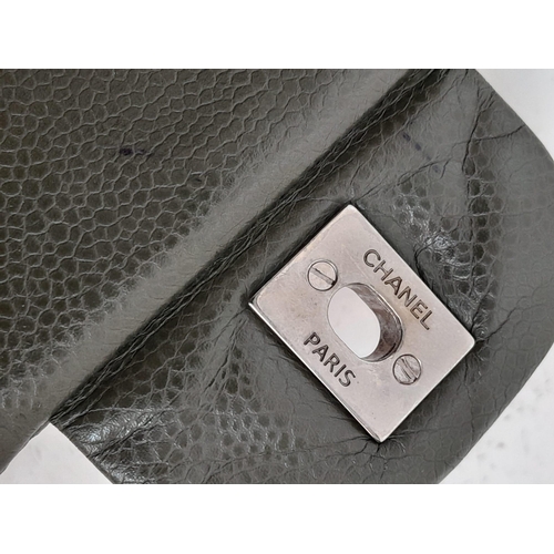 141 - A Chanel Green Jumbo Classic Double Flap Bag. Quilted leather exterior with silver-toned hardware, c... 