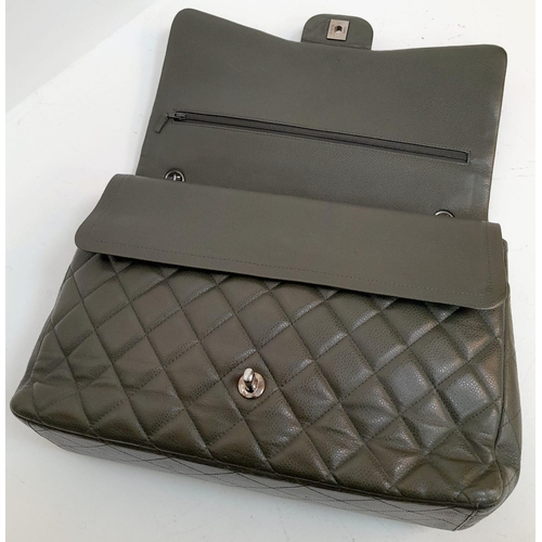 141 - A Chanel Green Jumbo Classic Double Flap Bag. Quilted leather exterior with silver-toned hardware, c... 