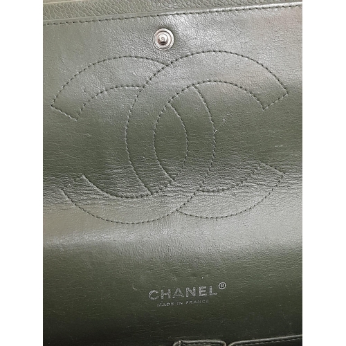 141 - A Chanel Green Jumbo Classic Double Flap Bag. Quilted leather exterior with silver-toned hardware, c... 