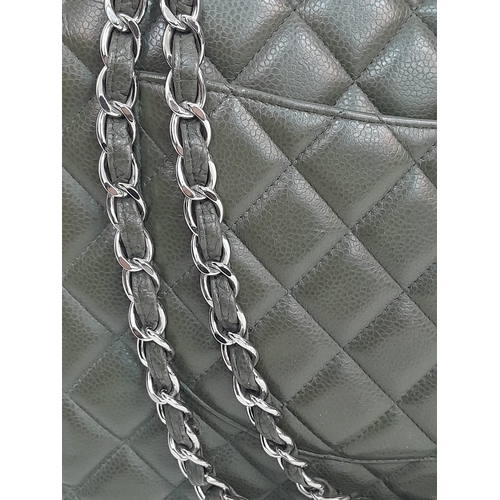 141 - A Chanel Green Jumbo Classic Double Flap Bag. Quilted leather exterior with silver-toned hardware, c... 