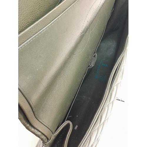 141 - A Chanel Green Jumbo Classic Double Flap Bag. Quilted leather exterior with silver-toned hardware, c... 