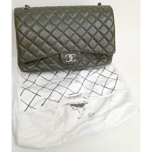 141 - A Chanel Green Jumbo Classic Double Flap Bag. Quilted leather exterior with silver-toned hardware, c... 