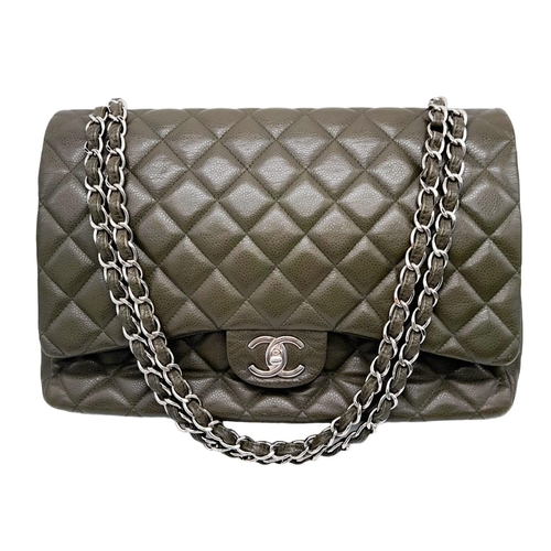 141 - A Chanel Green Jumbo Classic Double Flap Bag. Quilted leather exterior with silver-toned hardware, c... 