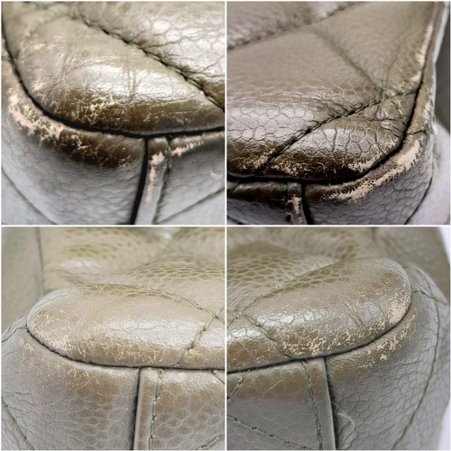 141 - A Chanel Green Jumbo Classic Double Flap Bag. Quilted leather exterior with silver-toned hardware, c... 