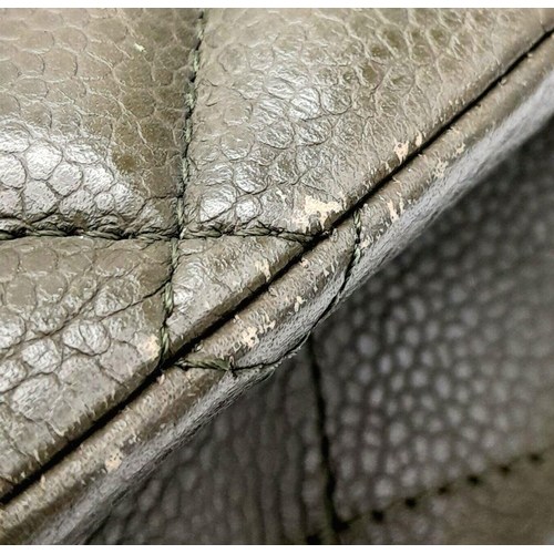 141 - A Chanel Green Jumbo Classic Double Flap Bag. Quilted leather exterior with silver-toned hardware, c... 