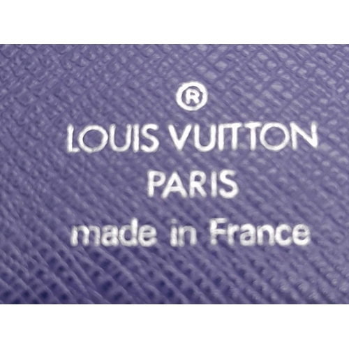 136 - A Vintage Louis Vuitton Blue Bifold Wallet. Epi leather exterior with silver-toned hardware and pres... 